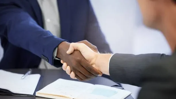 Image of an affiliate marketer shaking hands with a trusted customer